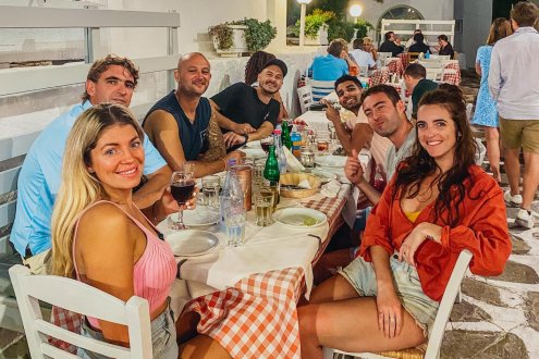 A group shot at dinner in Mykonos while island hopping around Greece